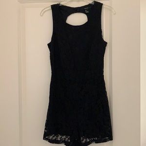 All black shirt jumpsuit.